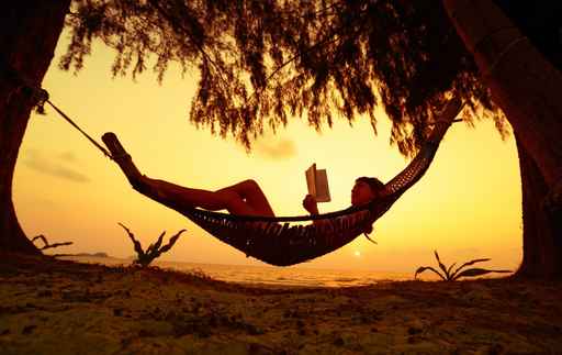 person reading in a hammock