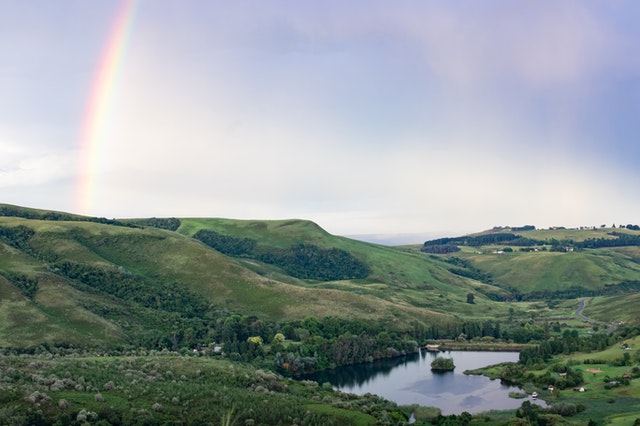 Rainbow under hills South Africa landscape